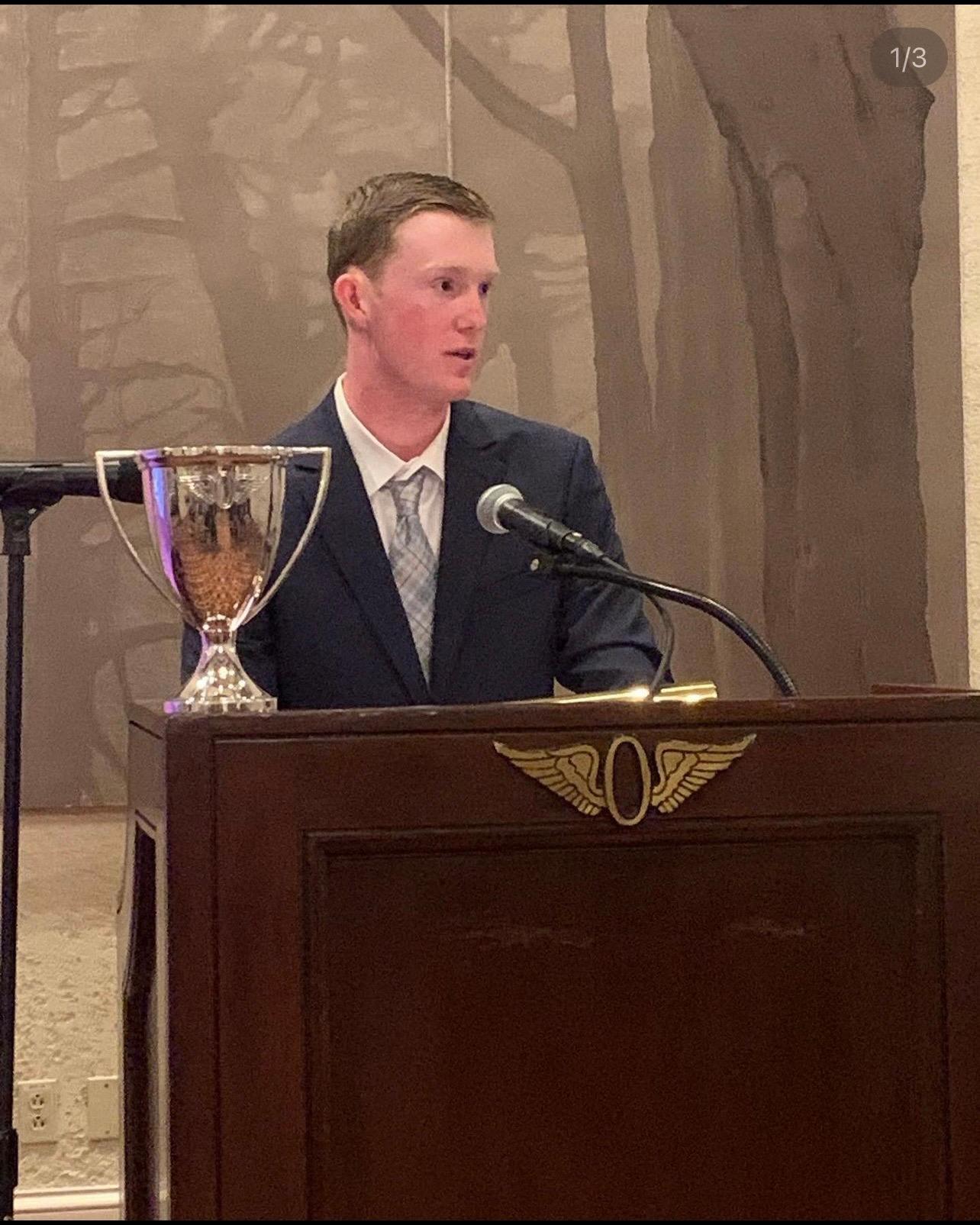 Cameron Keith speaking at an awards ceremony